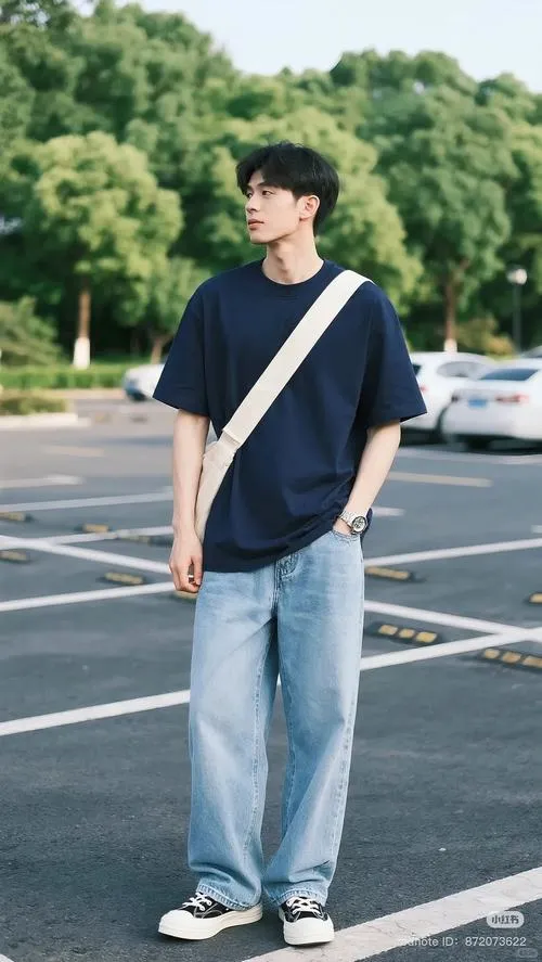 11 Mỹ nam áo thun tối màu phối quần jeans ống rộng cùng túi đeo chéo tạo chất đường phố trẻ trung và năng động